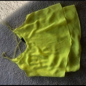 A used yellow string top